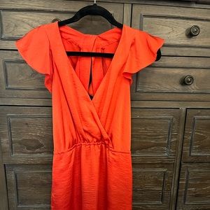 Orange BCBGeneration mini dress with pockets! Cute back detail & flutter sleeve